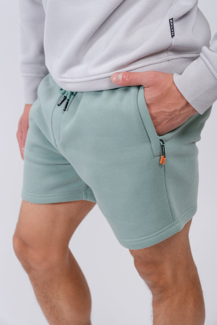 5 inseam men’s fleece shorts with zip pocket for convenience
#color_soft-moss