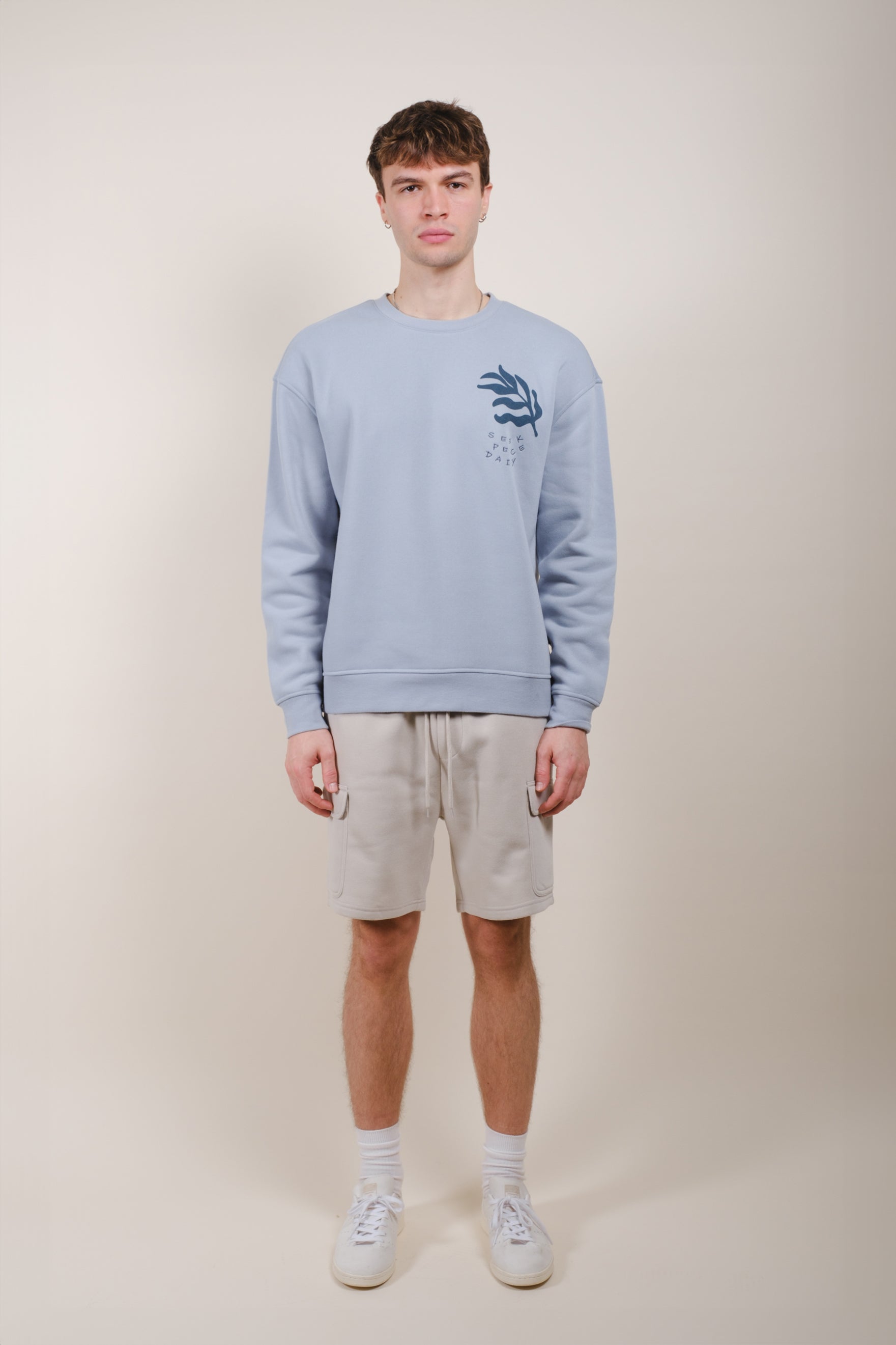 Men's 7 inch Core Fleece Cargo Short featuring a relaxed fit
#color_sand