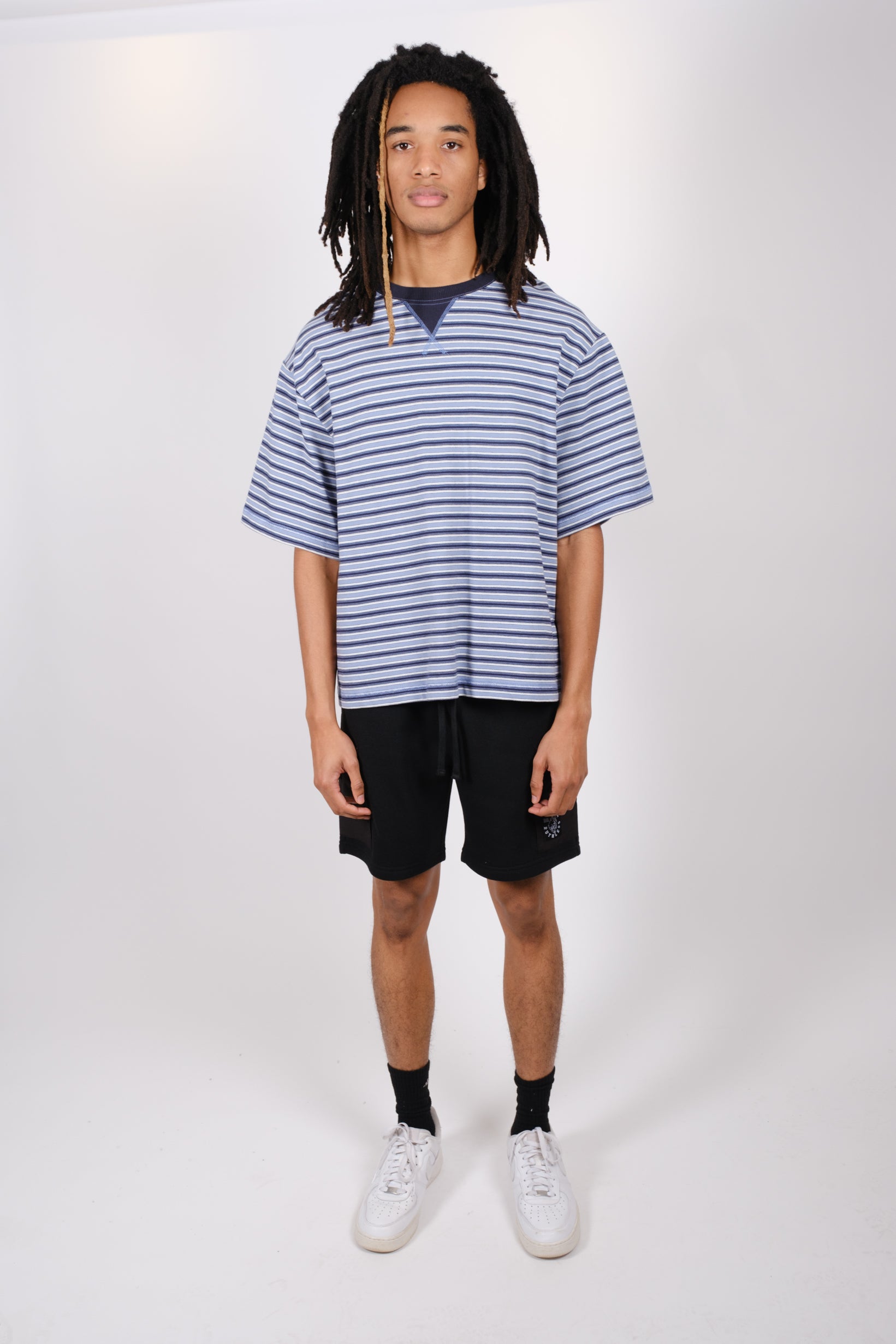 Stylish men's 7-inch fleece shorts with durable nylon pocket accents
#color_black