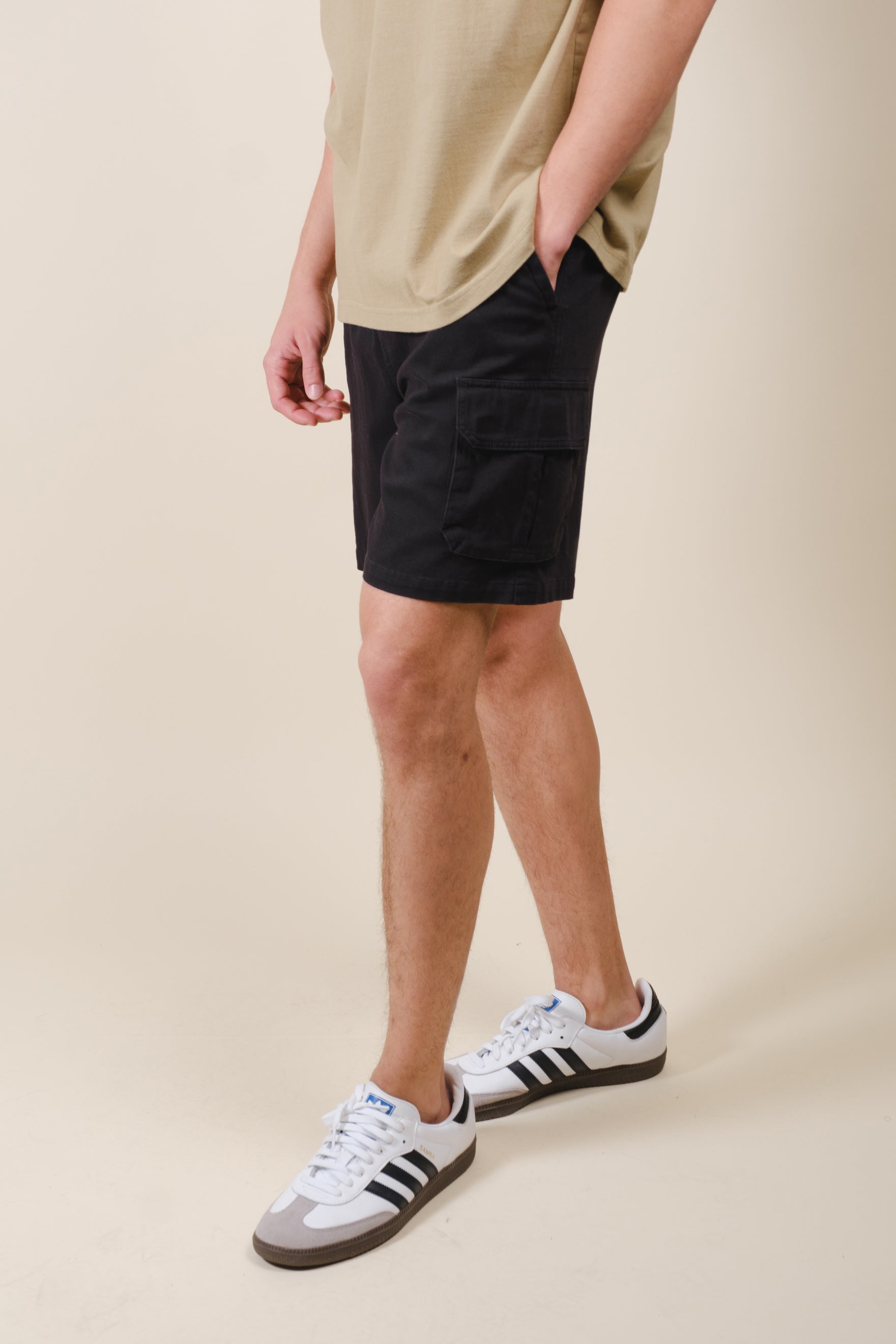 Men's black washed twill cargo shorts with cargo pocket detailing 
 #color_black
