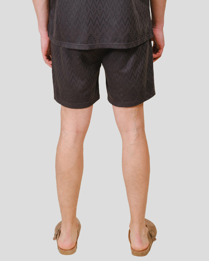 Mens dusty black knit shorts with an aztec jacquard pattern #color_dusty-black
