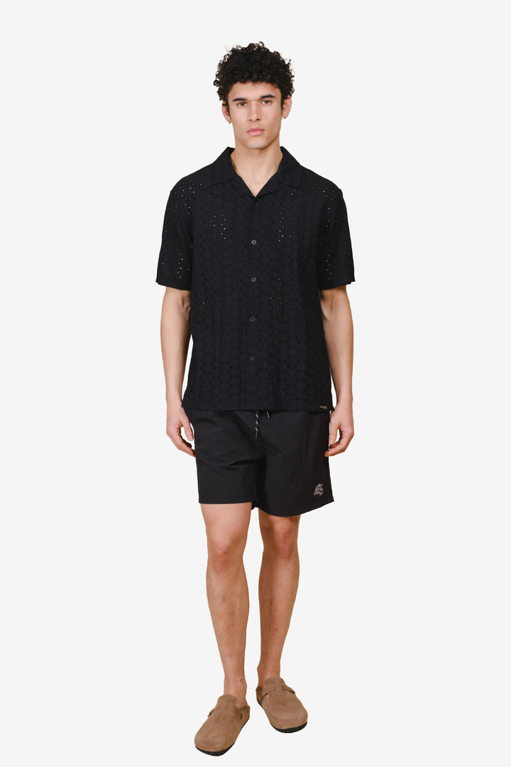 Men's monotone crinkle nylon shorts with flower detailing
#color_black