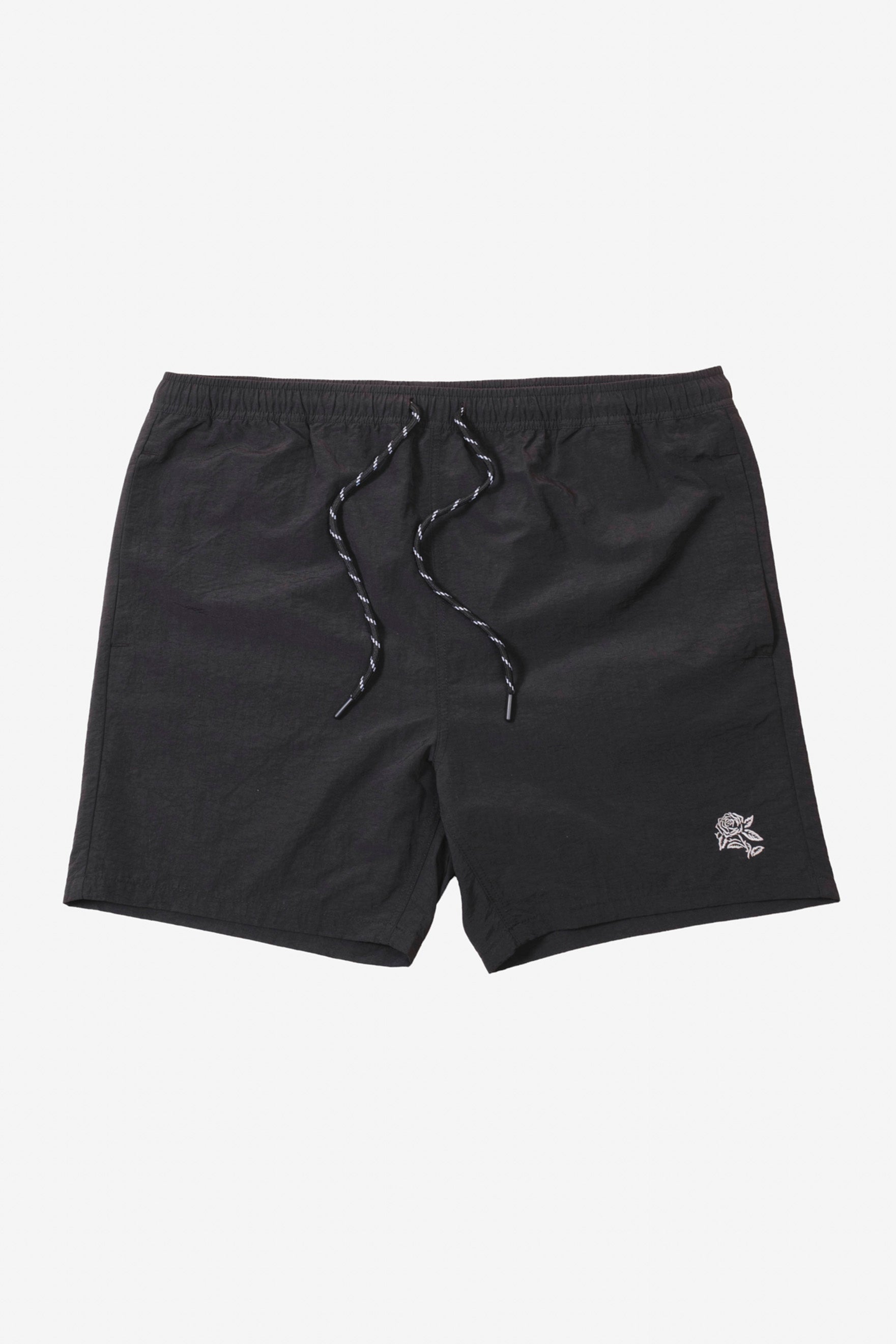 Casual men's monotone crinkle nylon shorts with a comfortable elastic band and white flower detail on bottom right corner #color_black