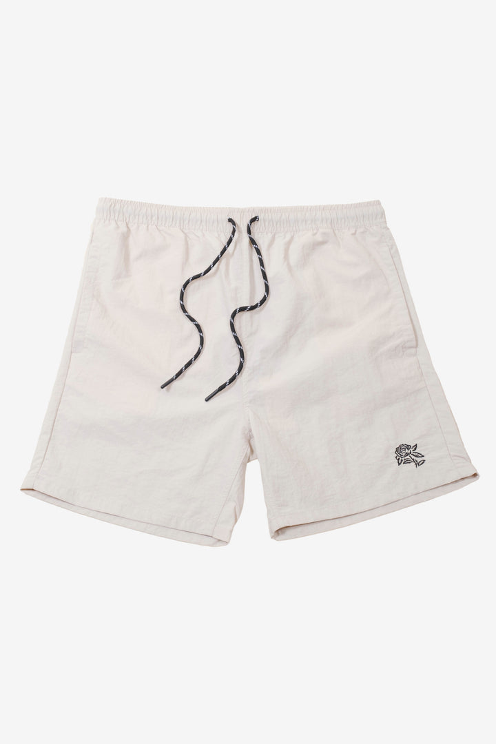 Men's monotone crinkle nylon shorts with flower detailing
#color_sand