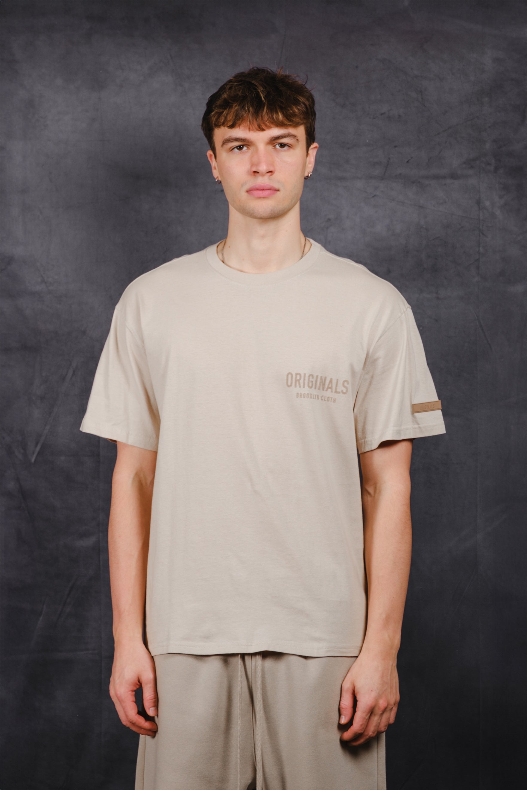 Men’s Originals Front Flock Tee with soft textured flock print on front
#color_pumice-stone