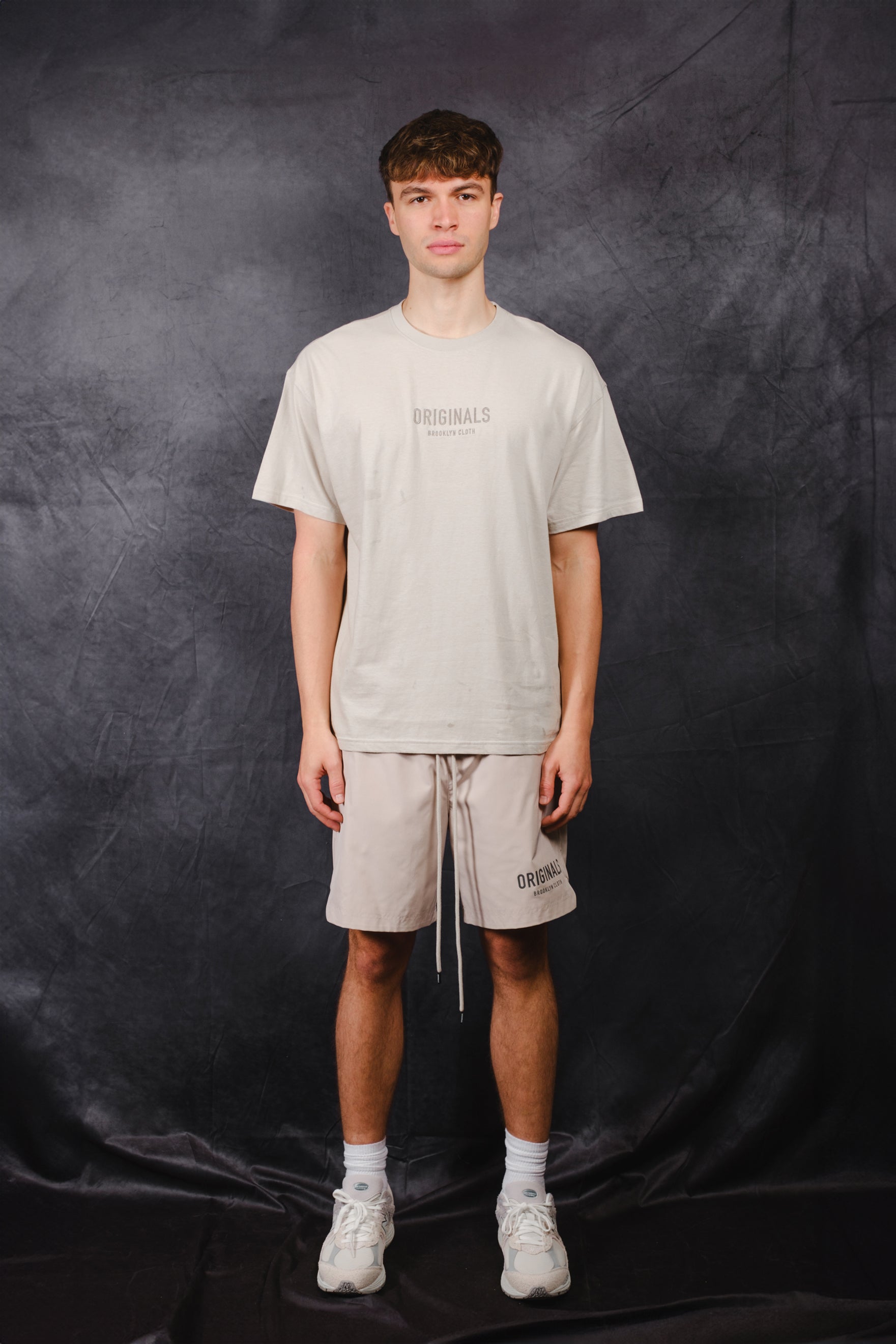 Tonal embroidery tee with logo on center chest and rubber patch on back
#color_pumice-stone