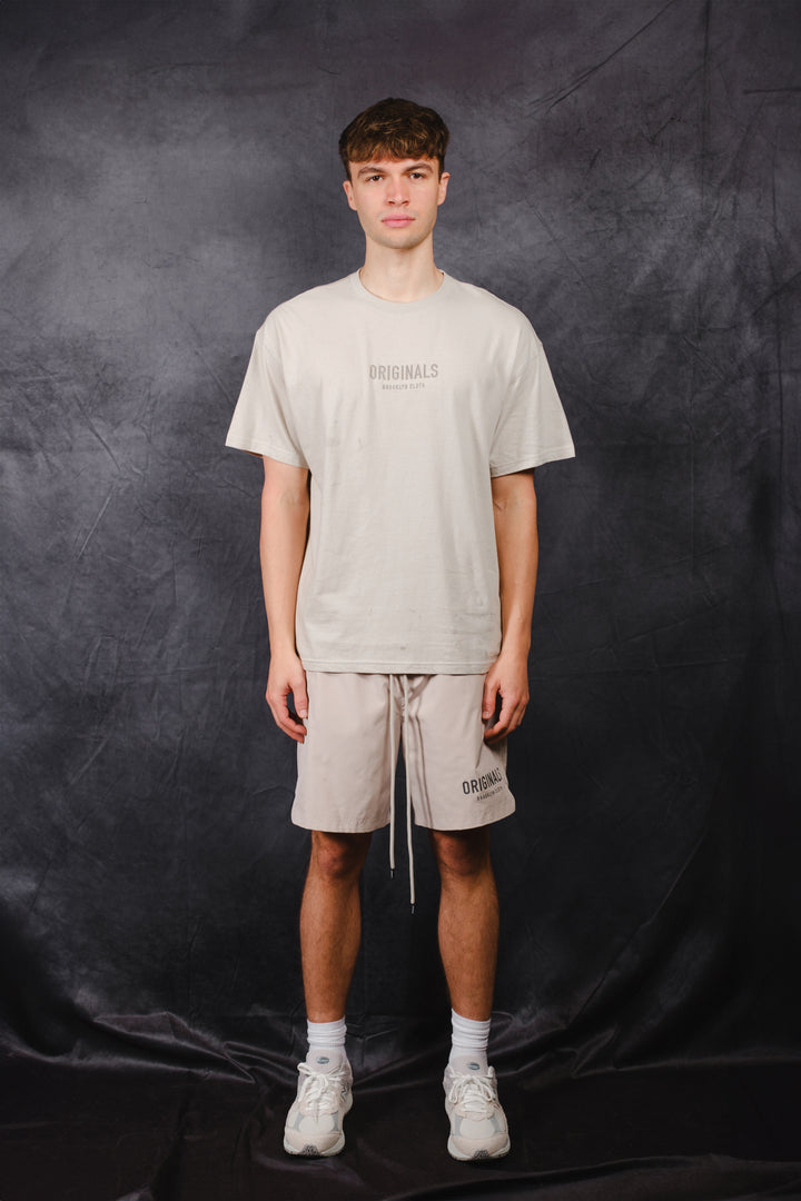 Tonal embroidery tee with logo on center chest and rubber patch on back
#color_pumice-stone