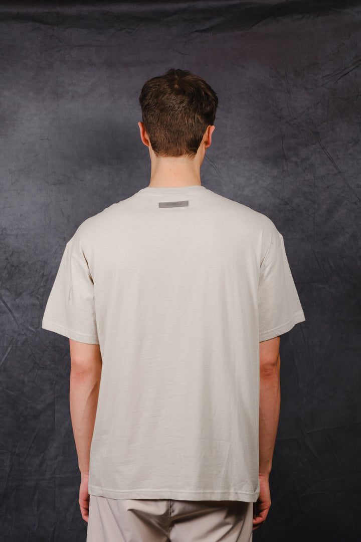 Premium relaxed fit t-shirt with rubber patch on back #color_pumice-stone
