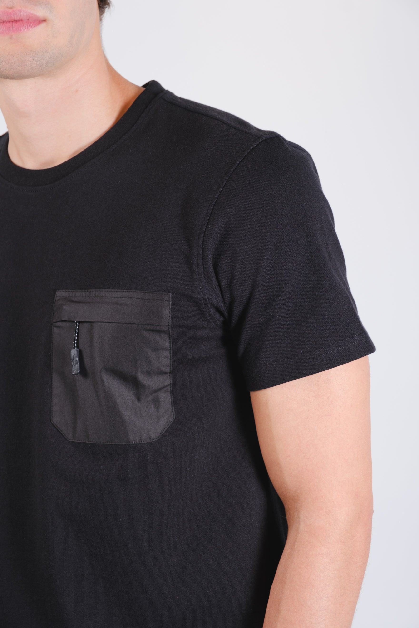 250 GSM nylon tee with relaxed fit and chest zip pocket
#color_black