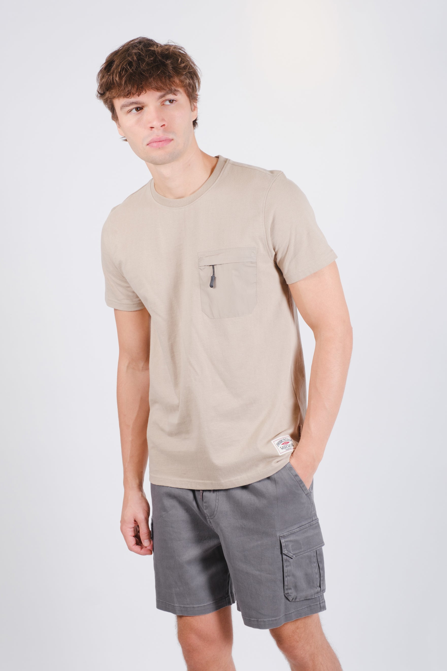 Relaxed fit nylon tee with zippered pocket detail on chest
#color_pumice-stone