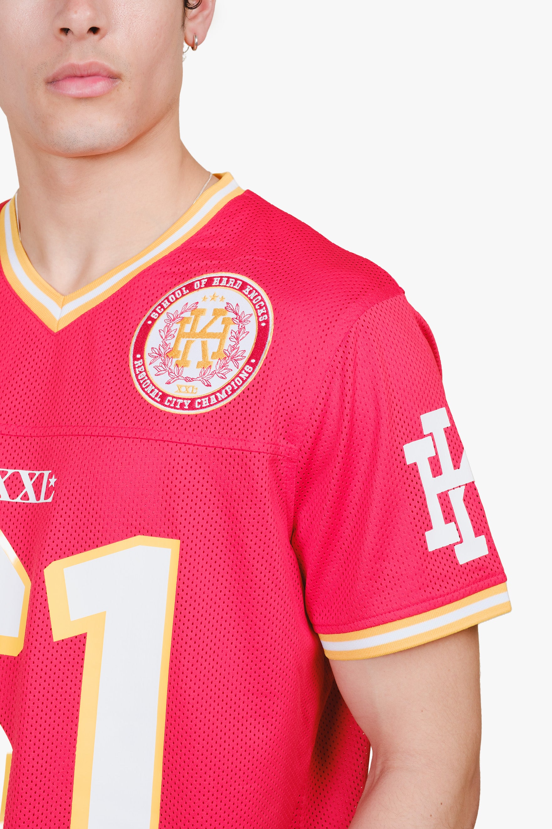 Red football jersey with hard knocks detailing #color_red