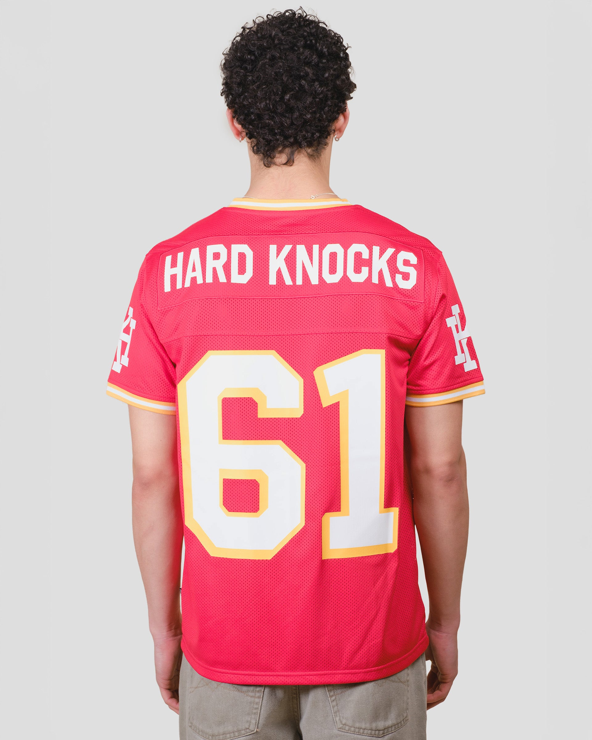 Red short sleeve hard knocks football jersey
#color_red