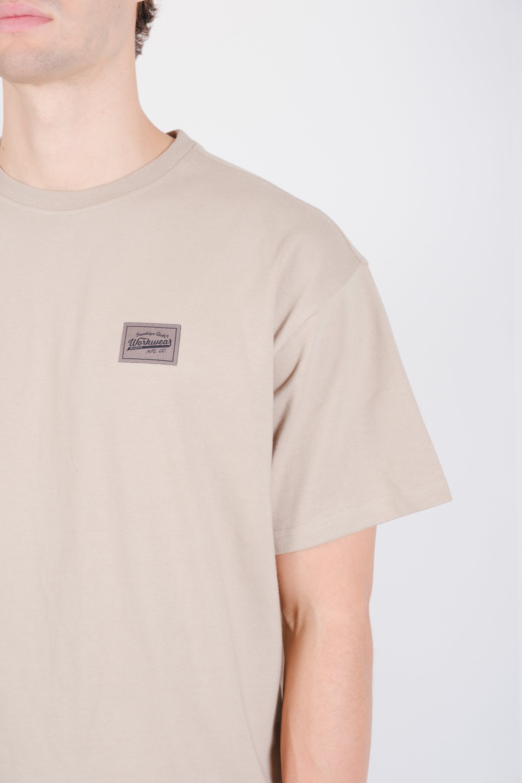 Workwear tee featuring a back graphic 
#color_pumice-stone_