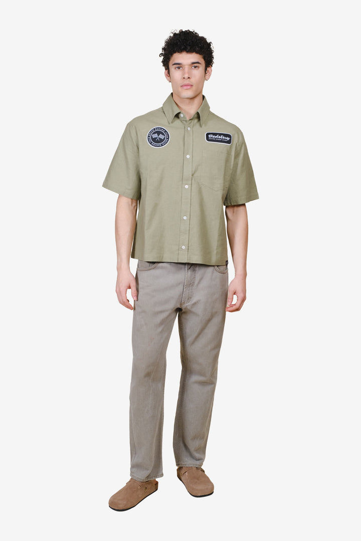 Boxy fit cropped short sleeve shirt with Bedstuy Motor club design detailing
#color_olive-gray