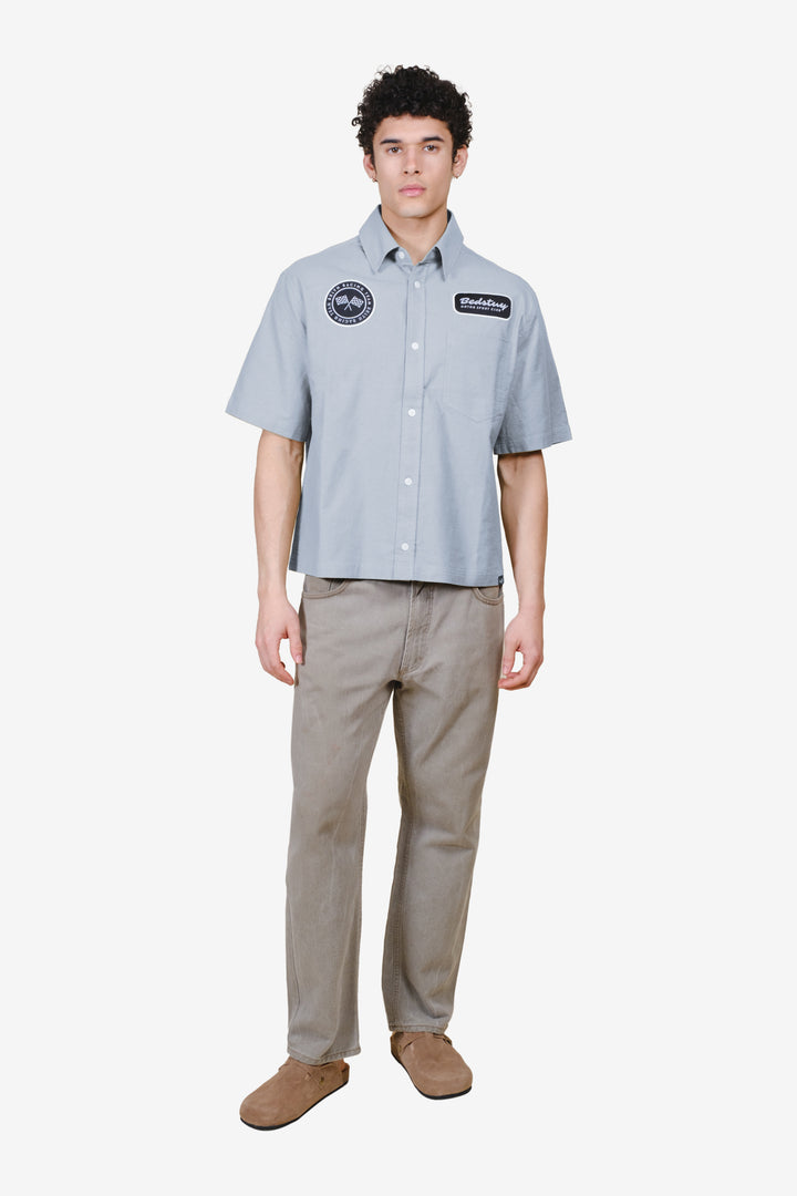 Easy to style, mens button up shirt with button up front and patch detailing on chest 
#color_quarry