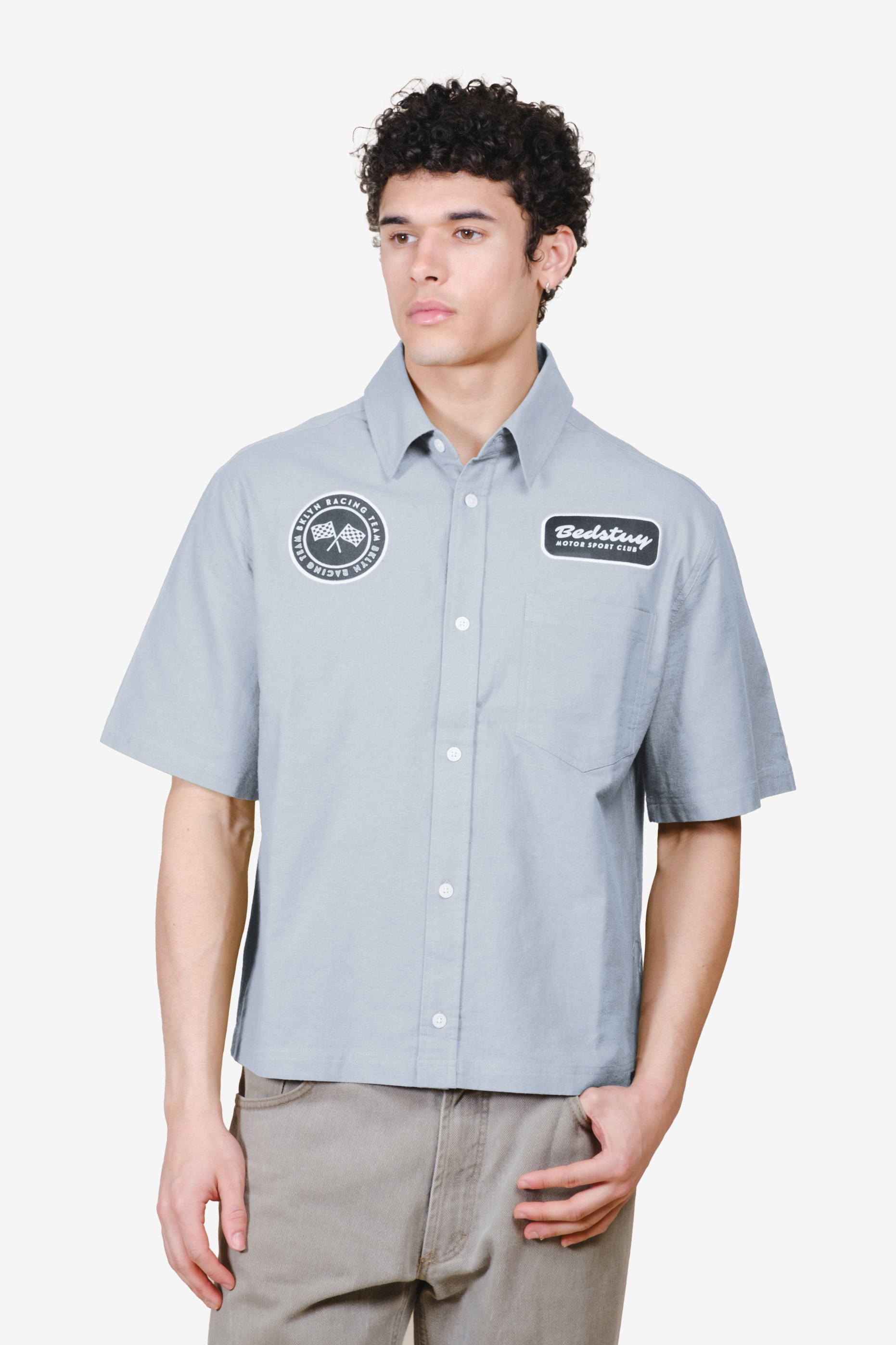 Men's cropped, boxy fit , button up top with patch detailing #color_quarry