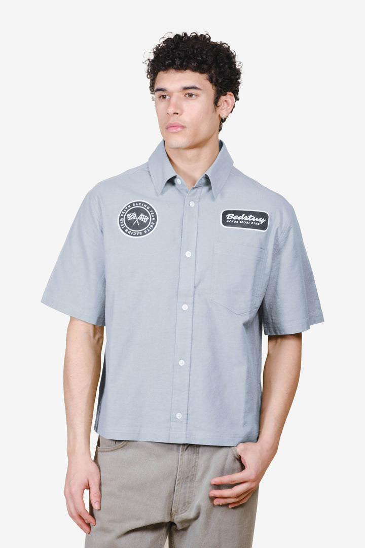 Men's cropped, boxy fit , button up top with patch detailing #color_quarry