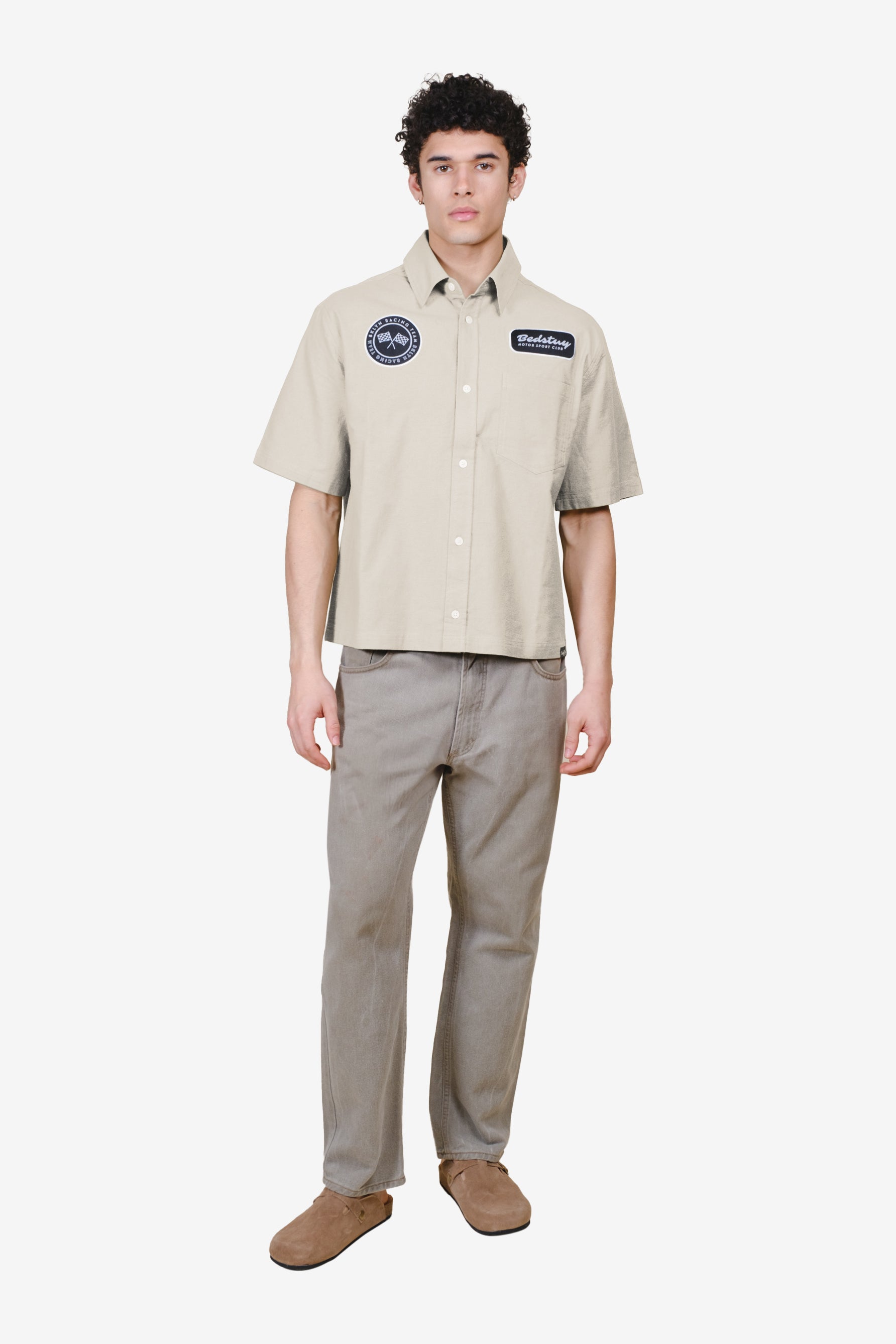 Cropped, boxy fit men's button up top with patch detailing 
#color_sand