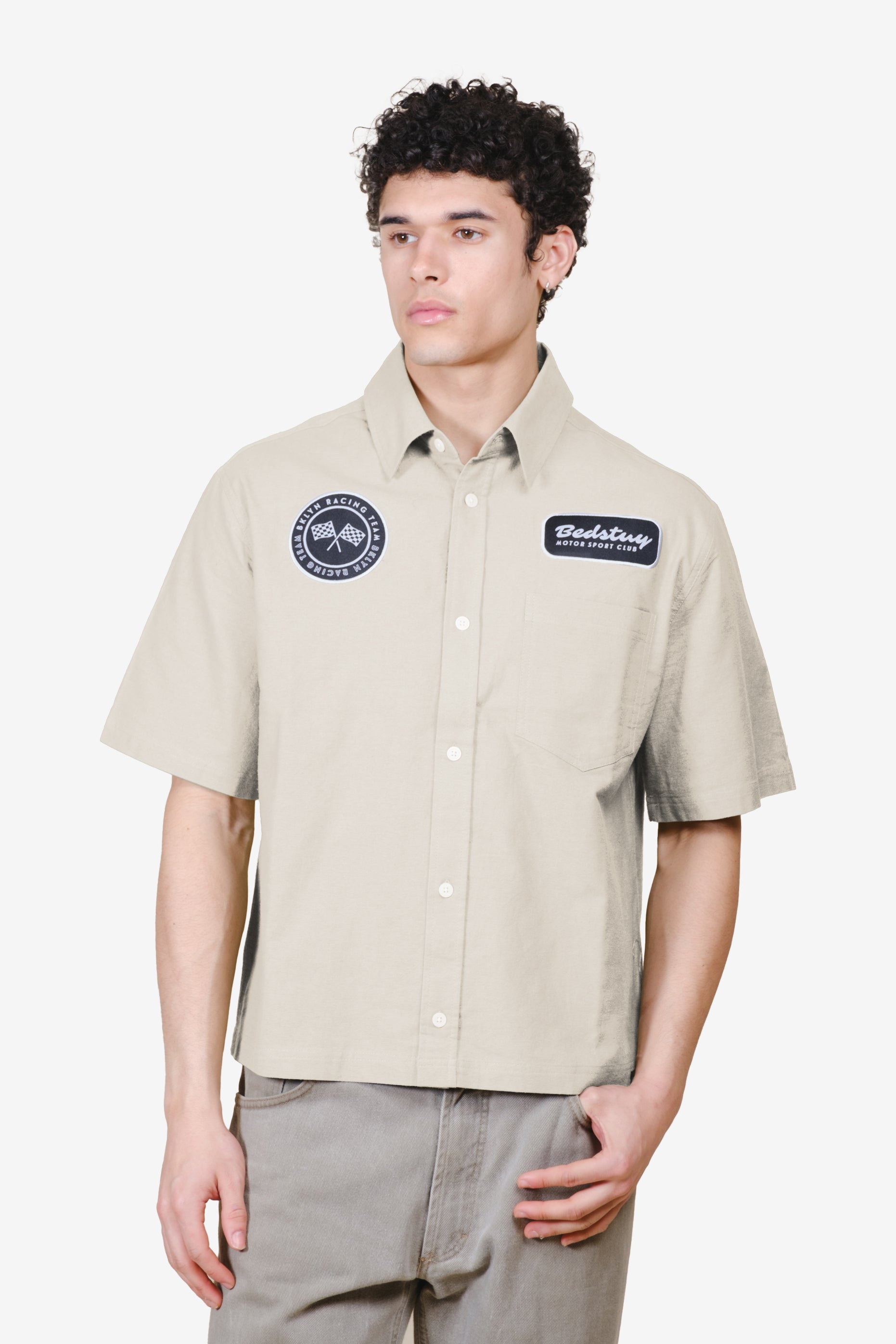 Stylish men's cropped button up shirt with patch detailing on chest #color_sand