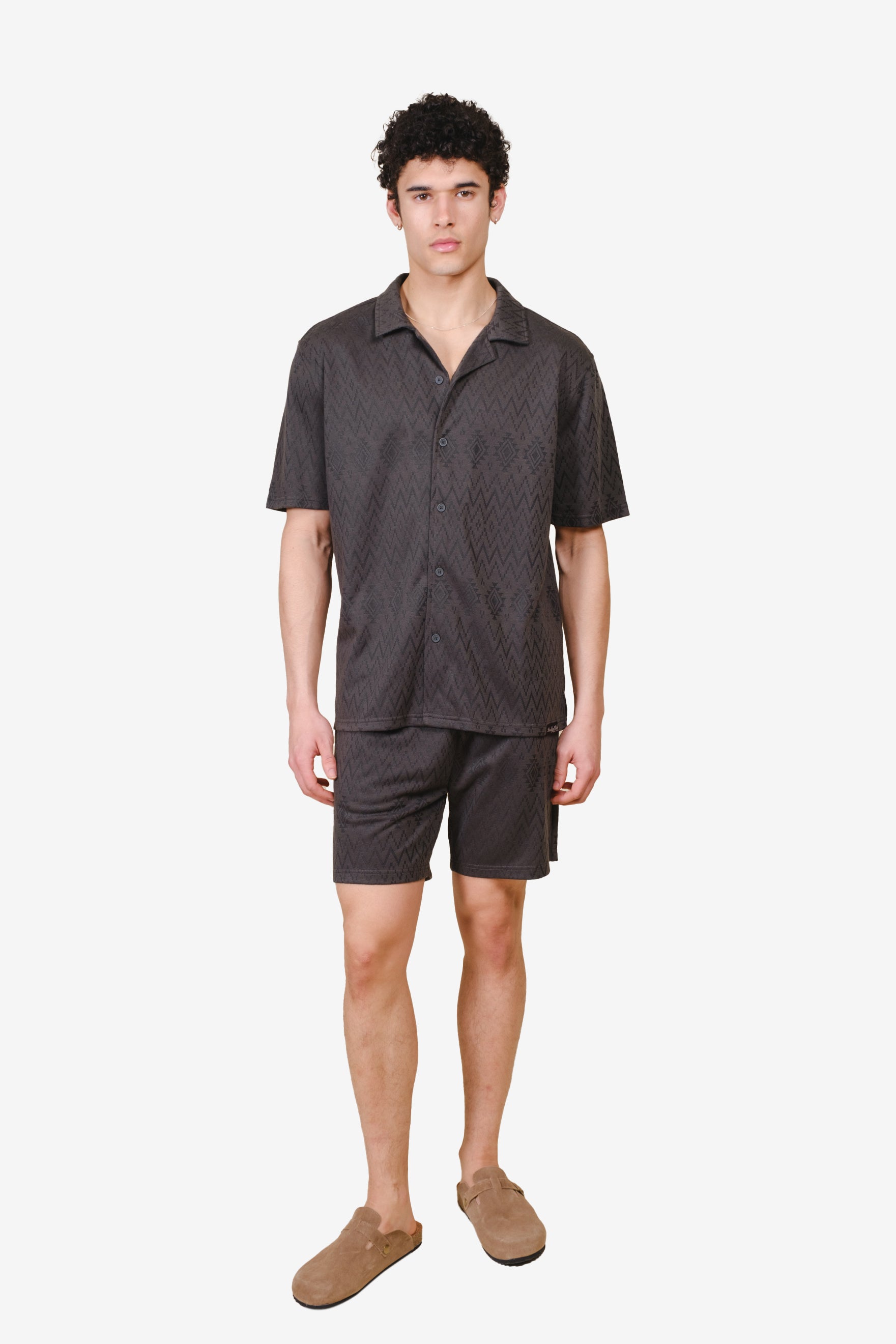 Mens dusty black knit shorts with an aztec jacquard pattern #color_dusty-black