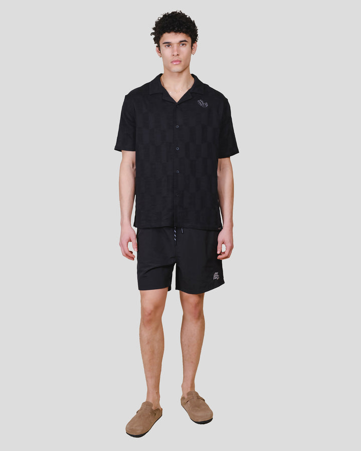 Men's relaxed fit button down woven top with camp collar and dice detail #color_black