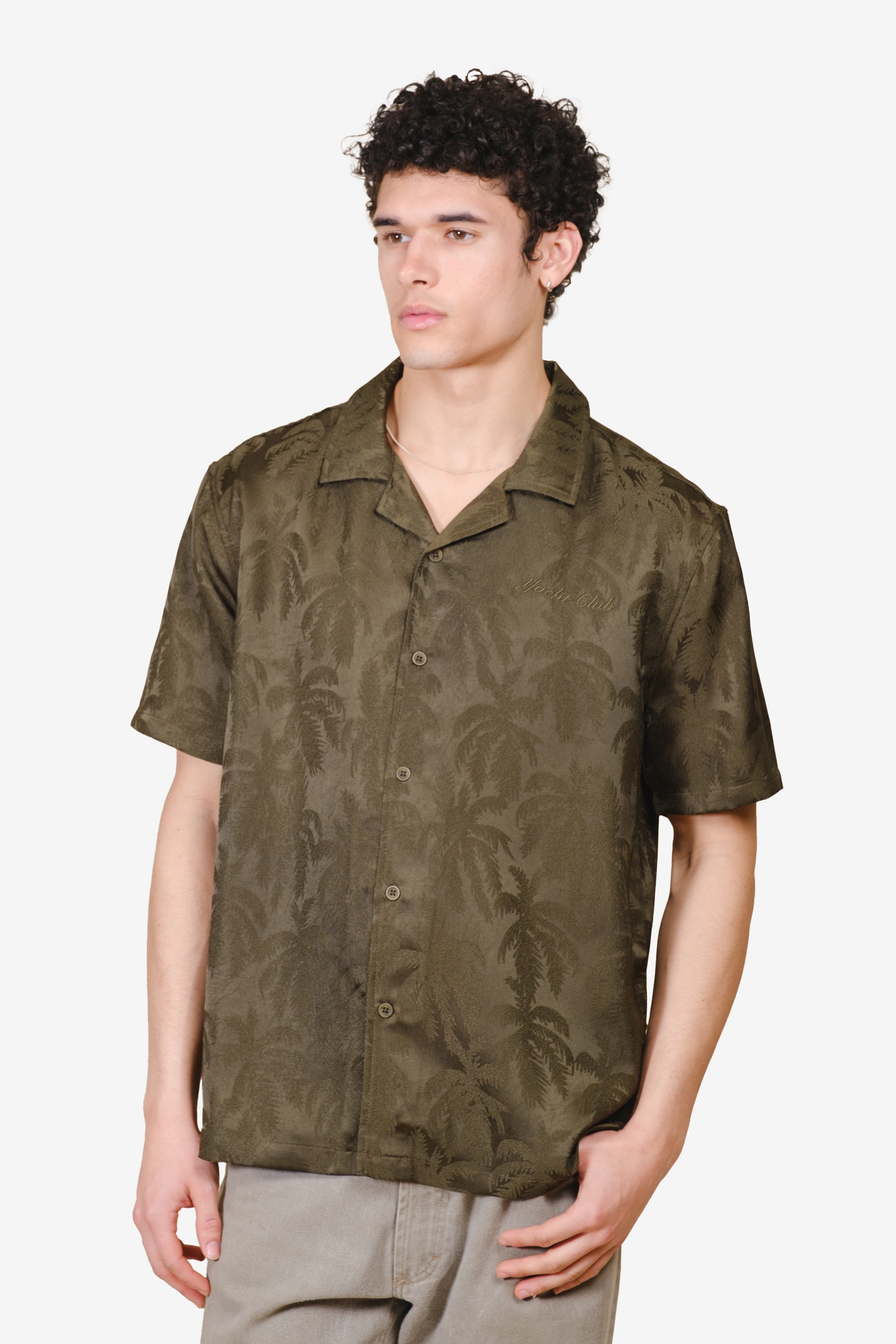 Men's camp shirt with button down front, camp collar and palm tree detailing
#color_olive