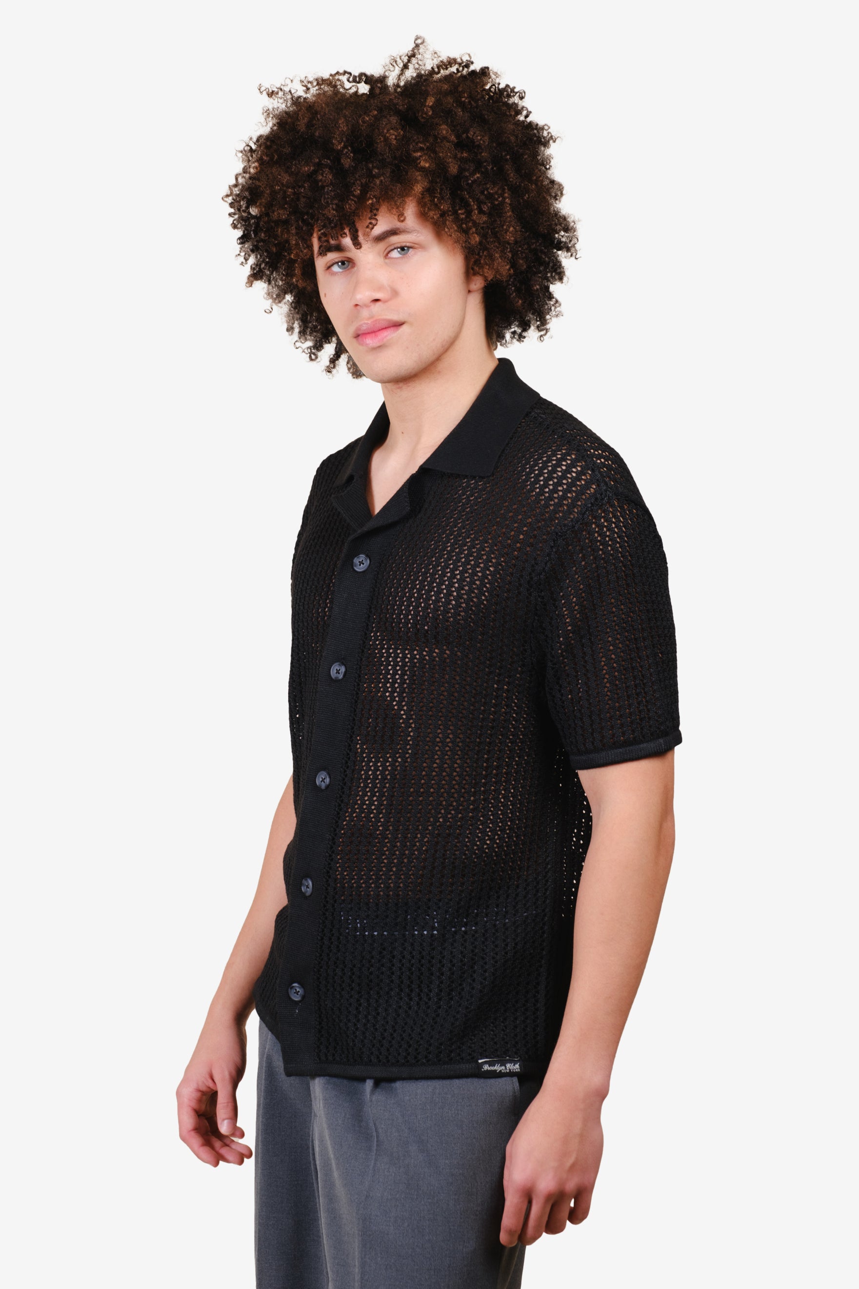 Men's loose knit camp shirt in black #color_black