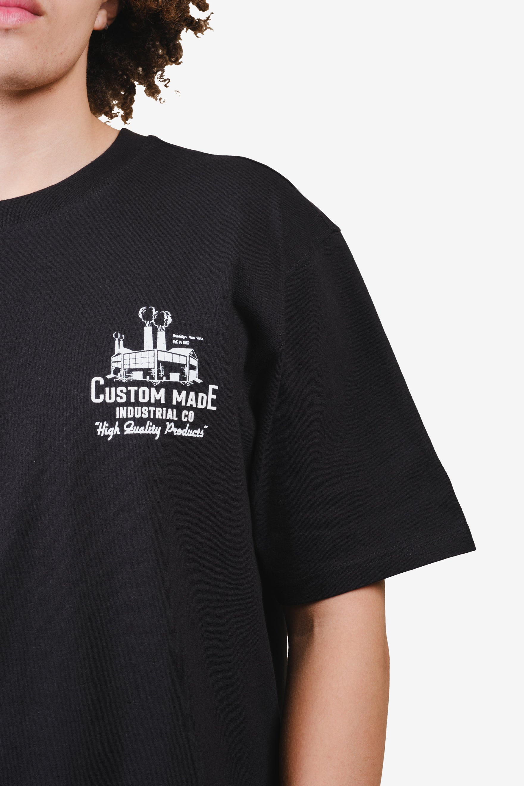 Black premium t-shirt with industrial artwork on upper left #color_black