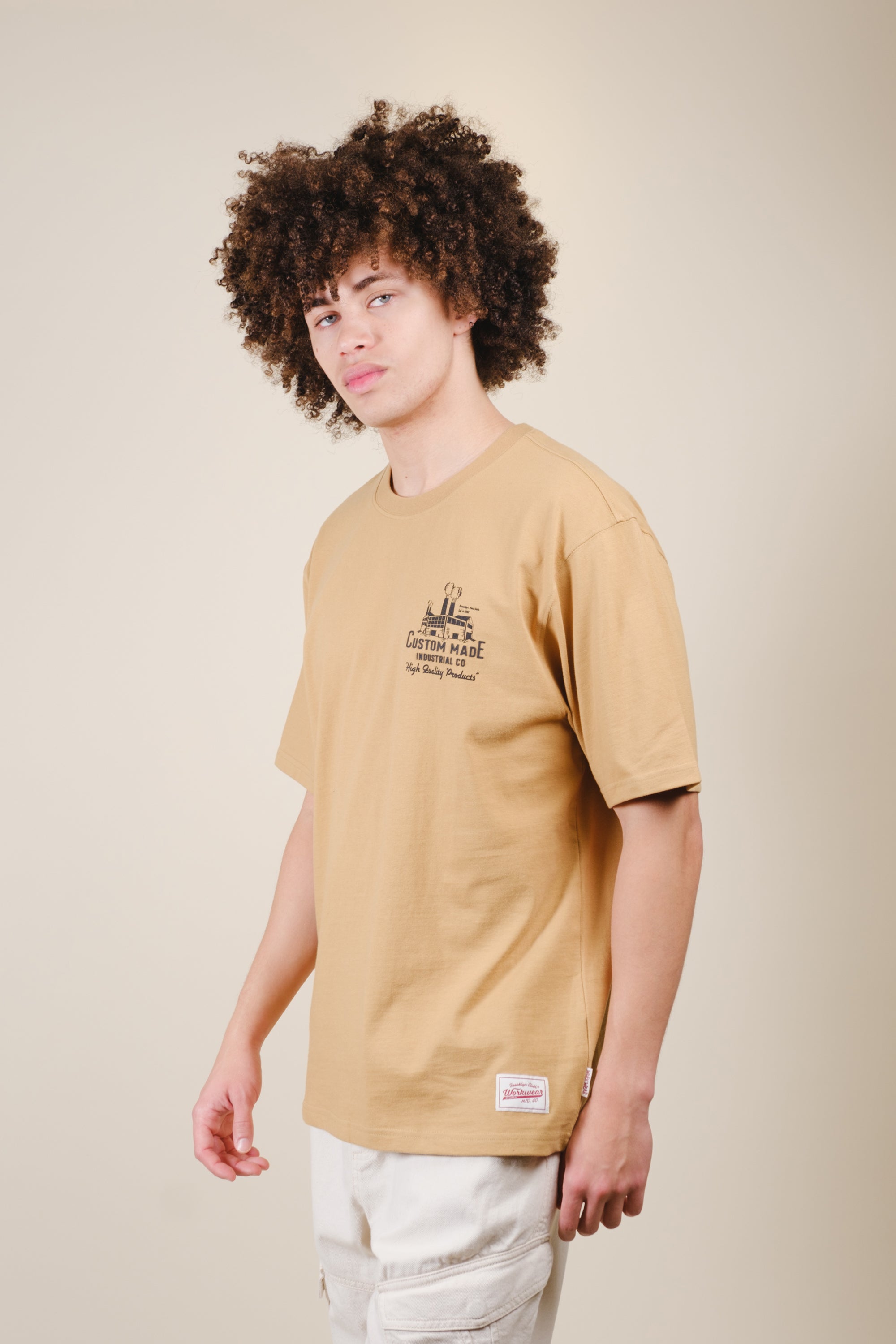 Heavyweight men's T-shirt with printed artwork and logo patch #color_curry