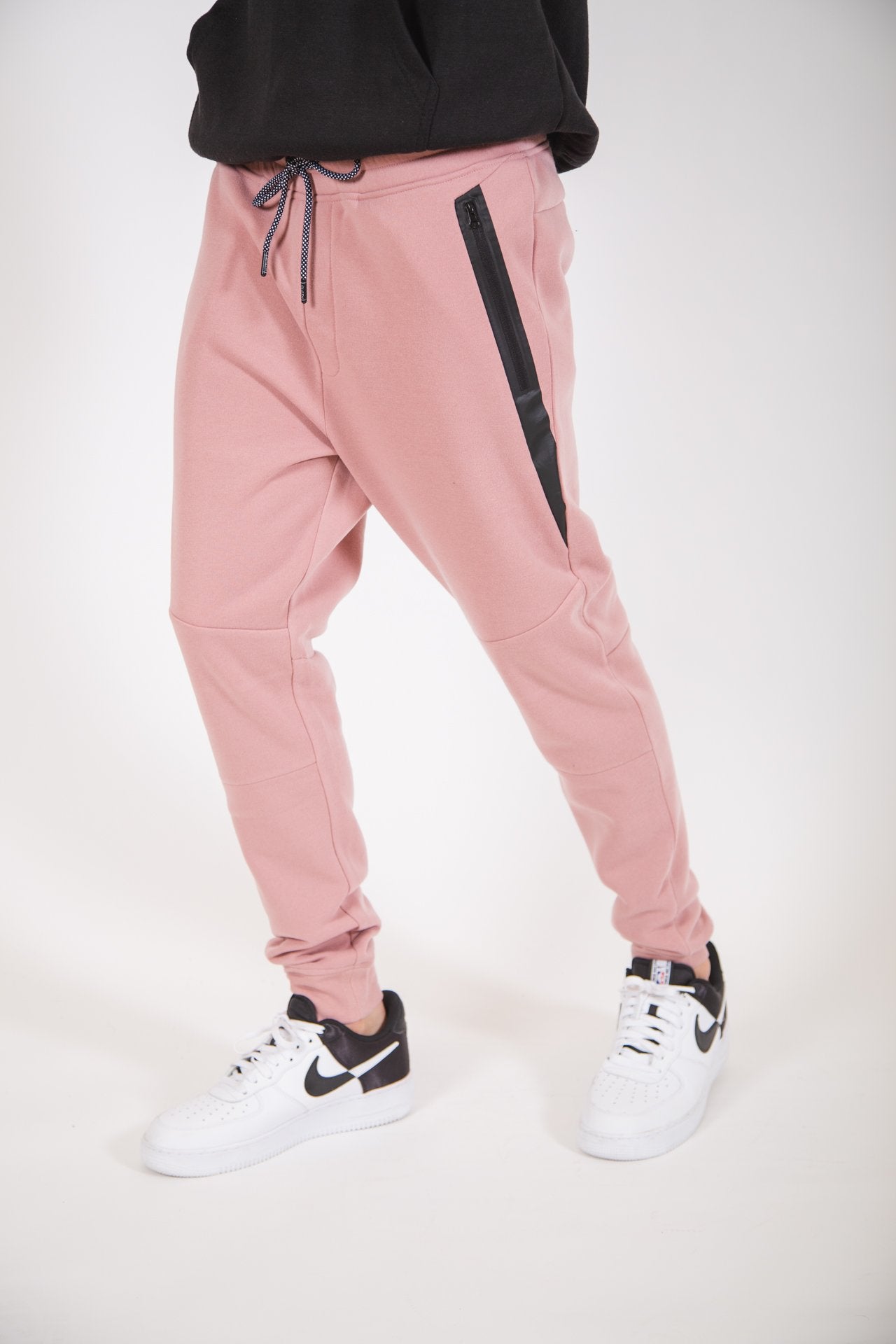 Dusty rose men's jogger pants in fleece with diagonal heat sealed pockets 
#color_dusty rose