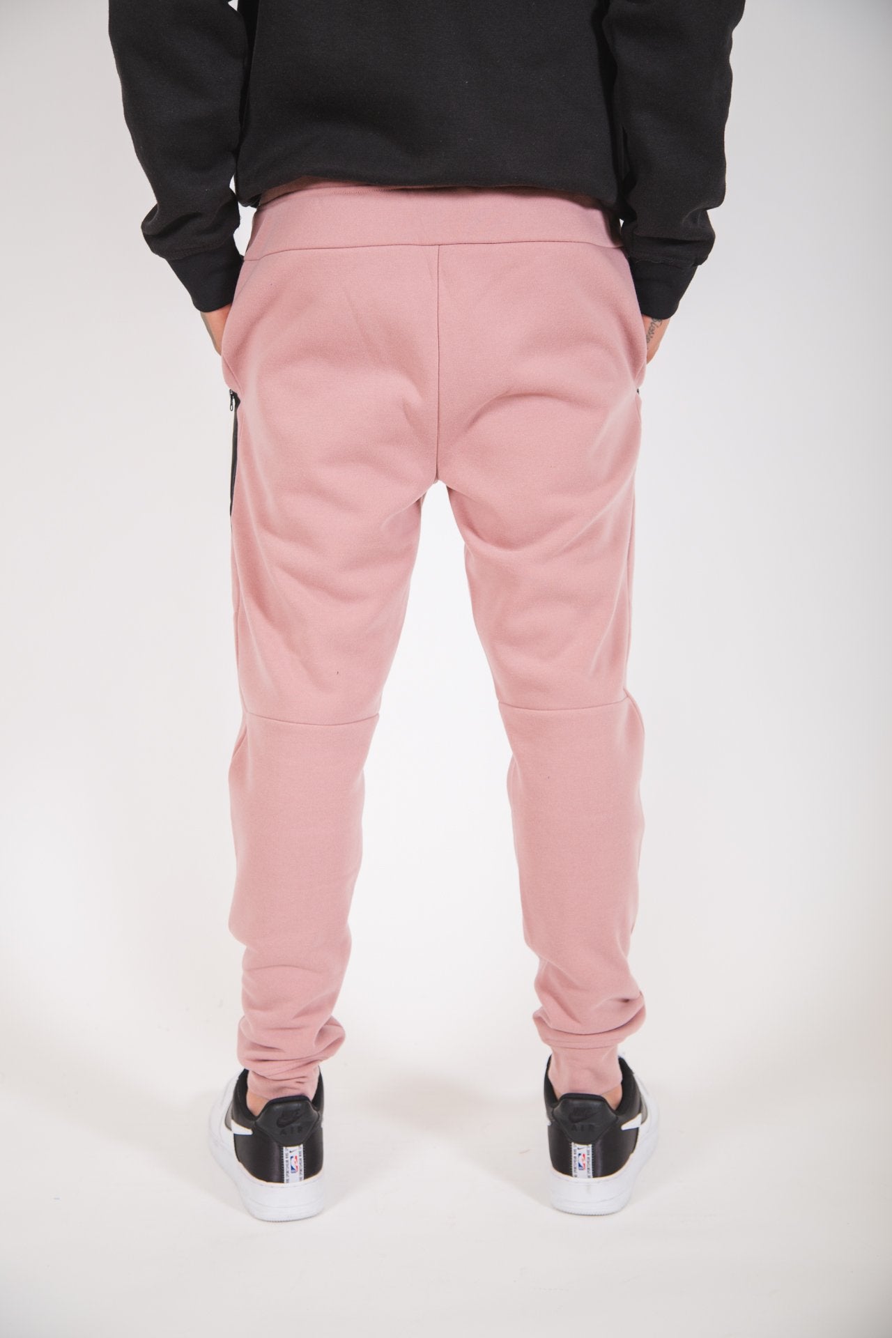 Dusty Rose fleece jogger pants for men with angled heat-sealed side pockets
#color_dusty-rose