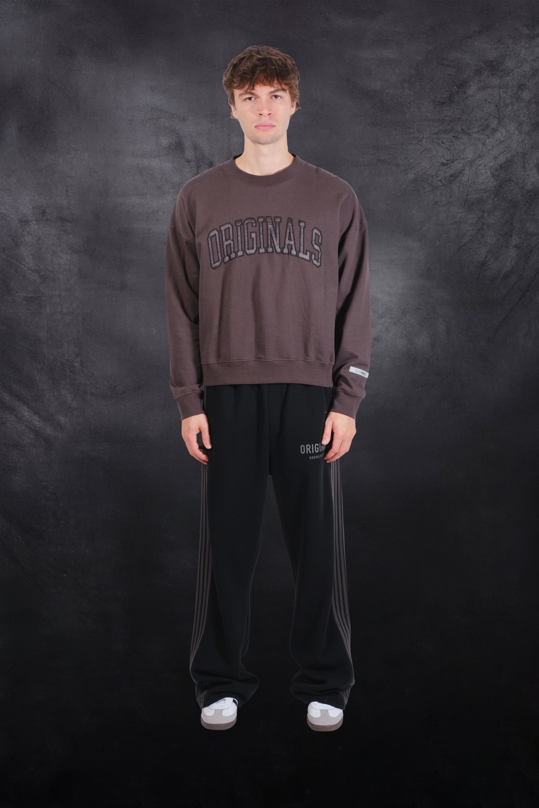 Soft crewneck sweatshirt with satin applique by Brooklyn Cloth
#color_dusty-black