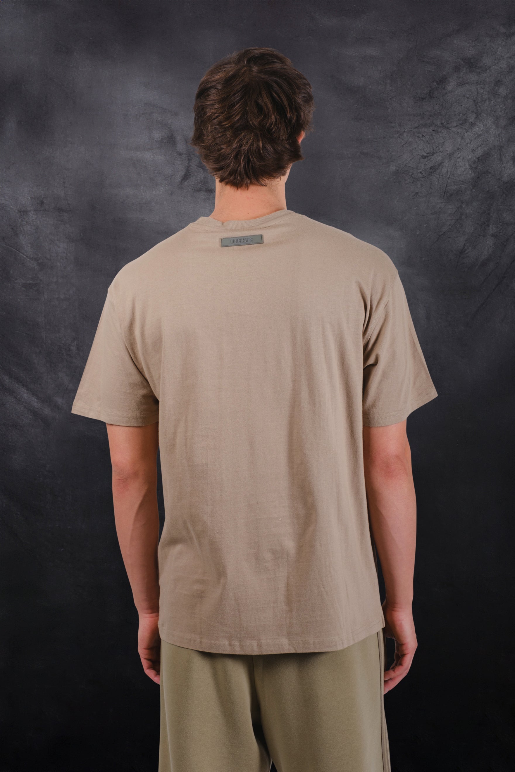 Soft cotton crew neck tee with bold satin applique logo design
#color_pumice-stone