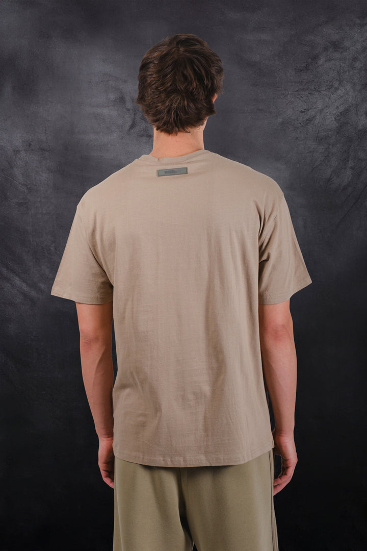 Soft cotton crew neck tee with bold satin applique logo design
#color_pumice-stone