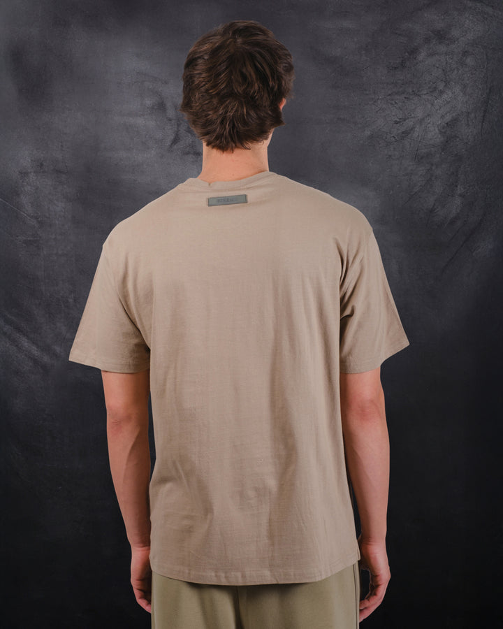 Soft cotton crew neck tee with bold satin applique logo design
#color_pumice-stone