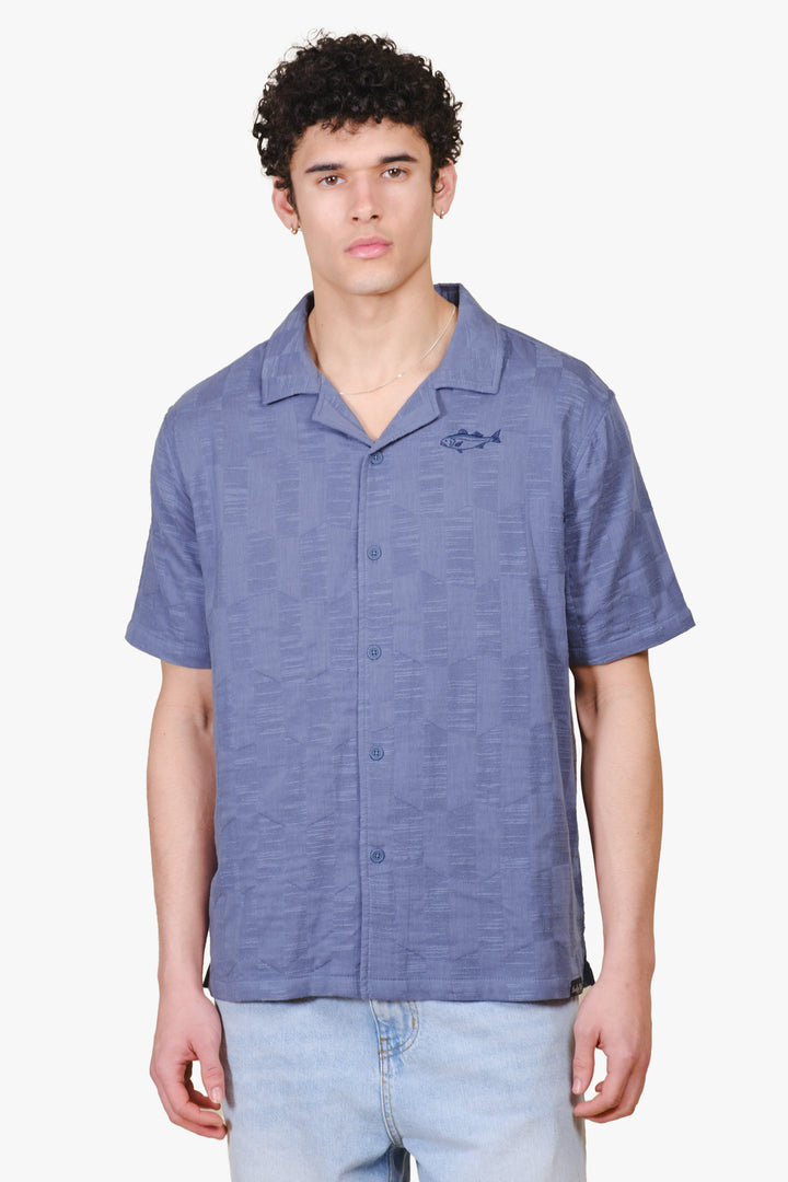 Men jacquard woven shirt with checkered detail and fish embroidery on chest 
#colorcoastalblue