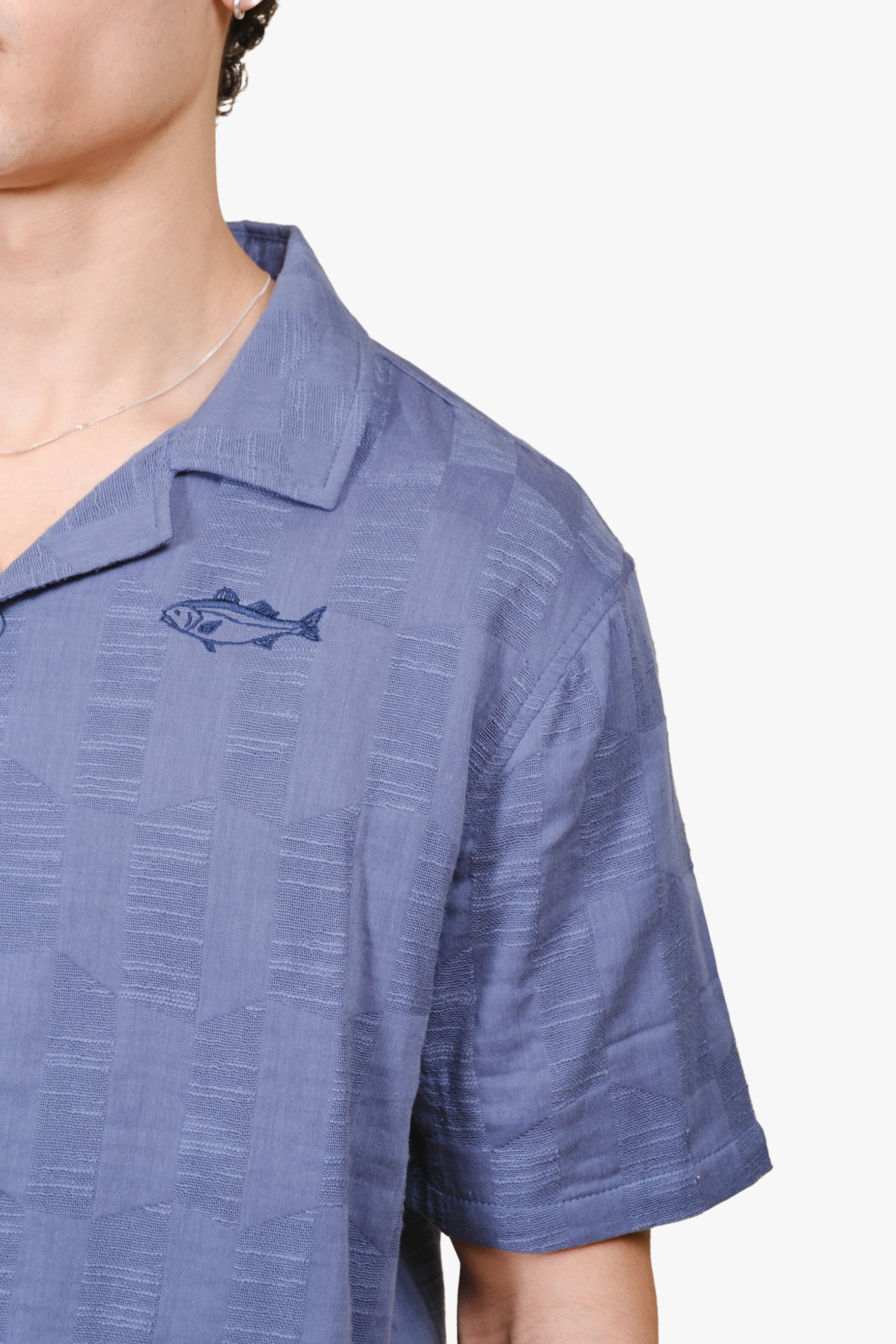 Men's woven shirt with textured checkered pattern and camp collar 
#colorcoastalblue